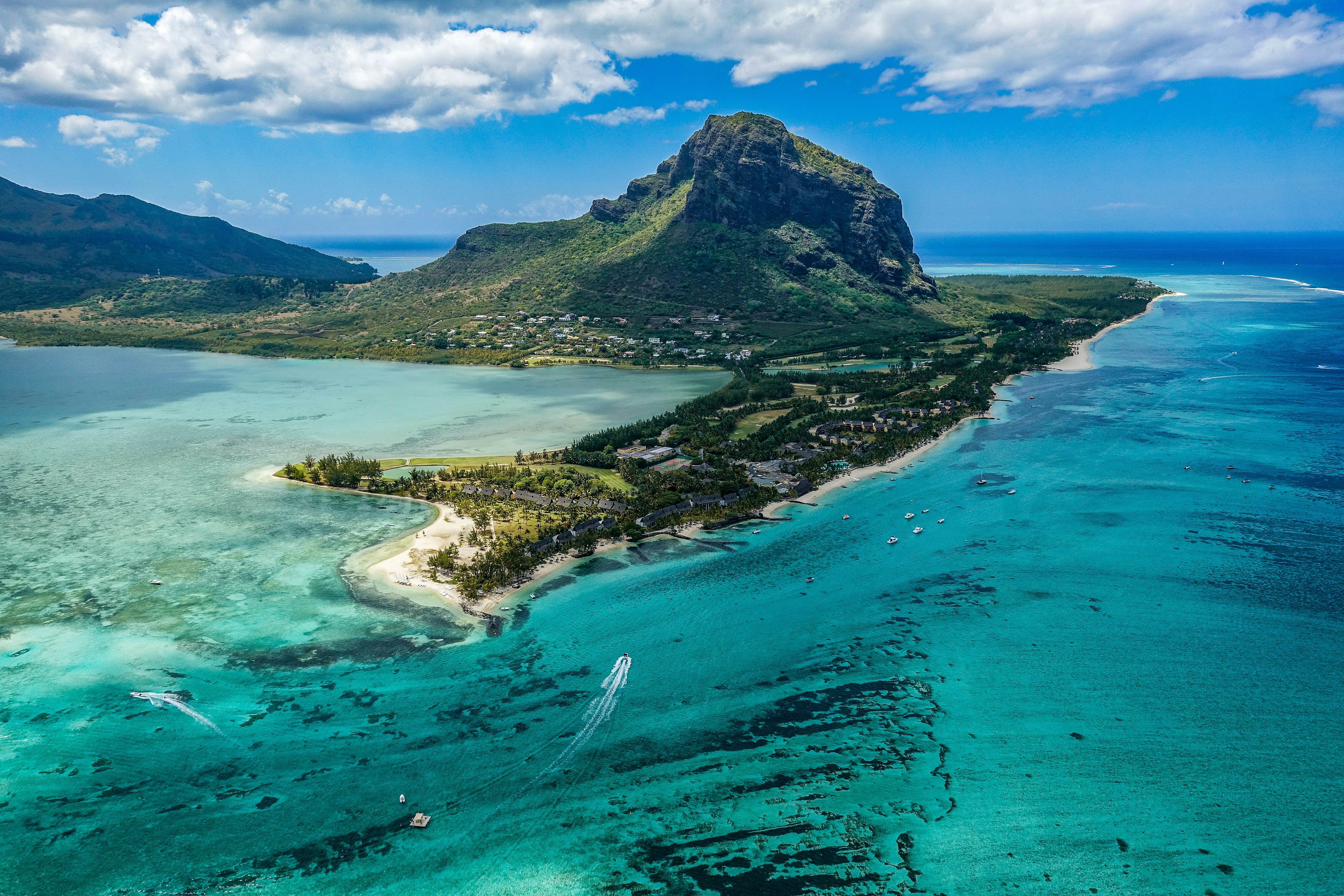 Aerial view of Le Morne peninsula and turquoise Mauritian lagoons