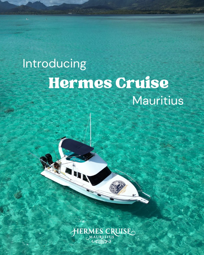 White private charter boat on turquoise water near the Mauritius coastline
