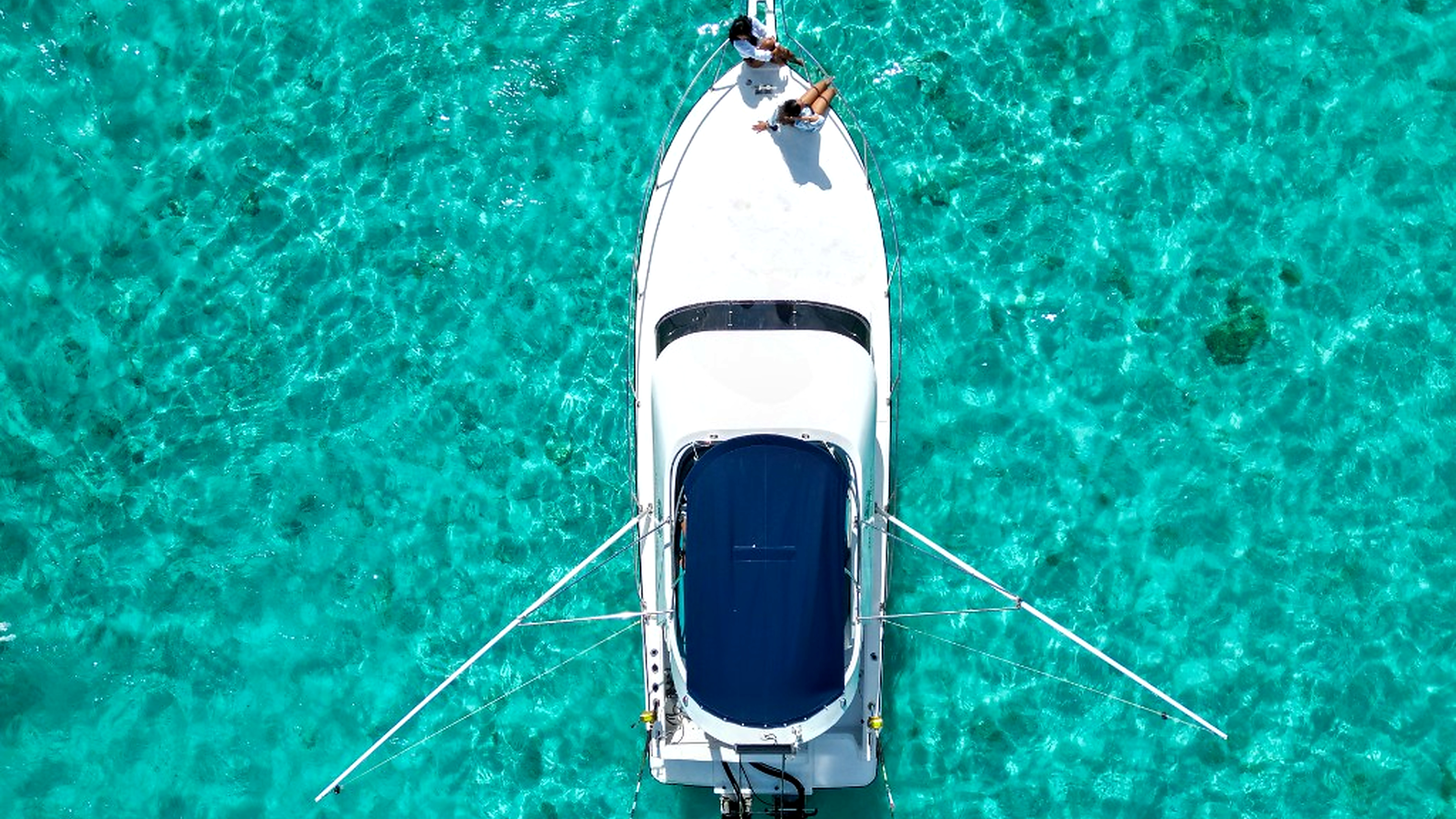 Aerial view of the Hermes Cruise boat on crystal-clear turquoise lagoon water in Mauritius