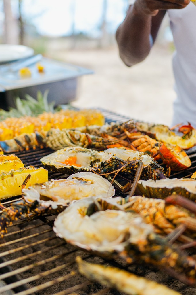 Close-up of grilled lobster and pineapple on the BBQ